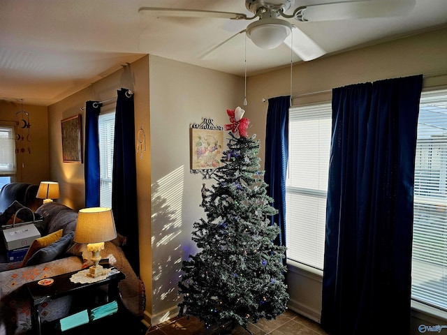 interior space featuring tile patterned floors, ceiling fan, and a wealth of natural light