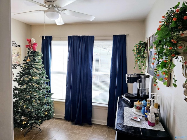 office area with ceiling fan, a healthy amount of sunlight, and light tile patterned flooring