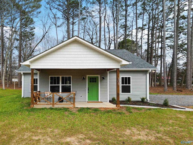 view of front of home featuring a front yard and a porch