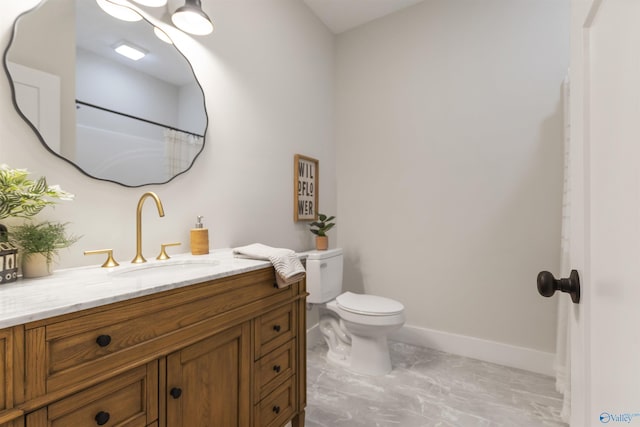 bathroom with vanity and toilet