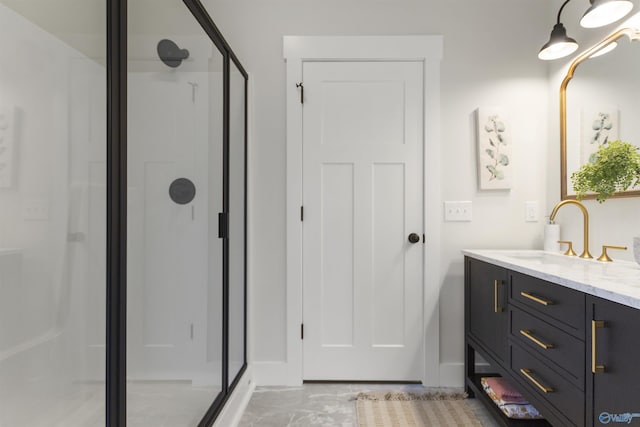 bathroom with vanity and a shower with door