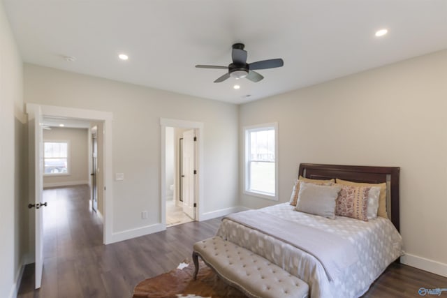 bedroom with dark hardwood / wood-style floors and ceiling fan