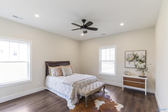 bedroom featuring ceiling fan and dark hardwood / wood-style floors