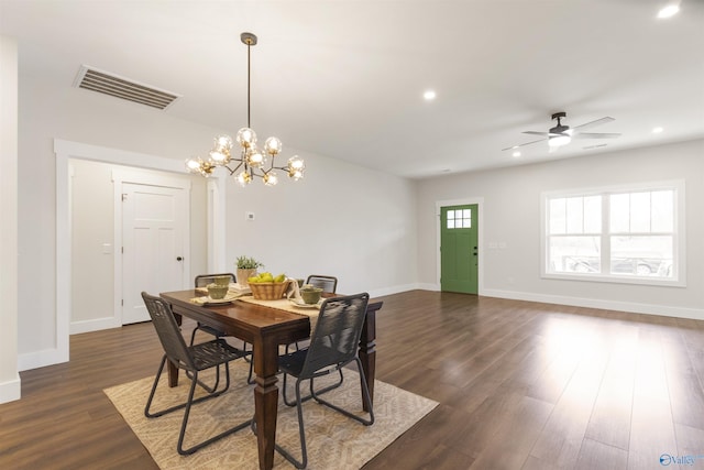 dining space with dark wood-type flooring and ceiling fan