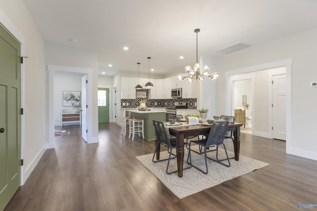 dining area with dark hardwood / wood-style flooring