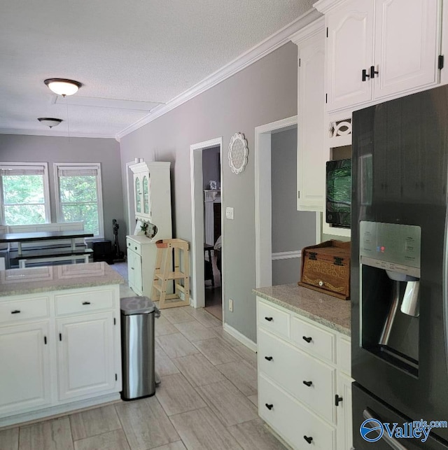 2340 Pine Lake Trl, Arab, AL 35016 - kitchen with crown molding, white cabinets, black fridge, and a textured ceiling