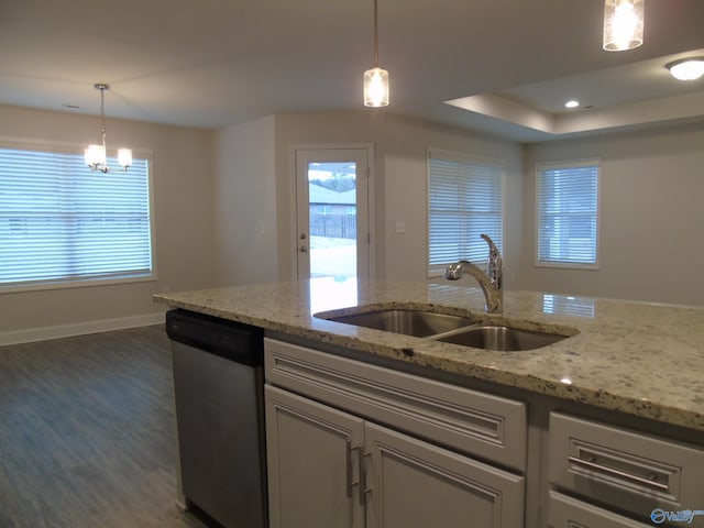 kitchen featuring a sink, decorative light fixtures, baseboards, dishwasher, and dark wood-style flooring