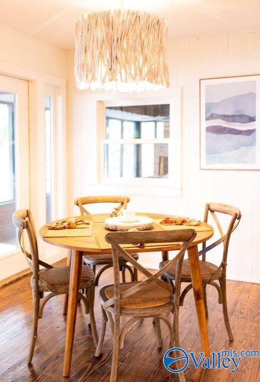 dining space featuring wood-type flooring