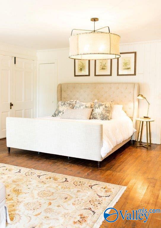 bedroom with wood-type flooring