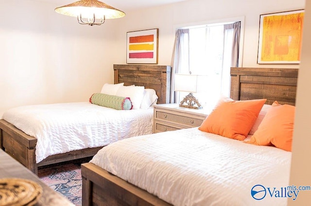 bedroom with a chandelier