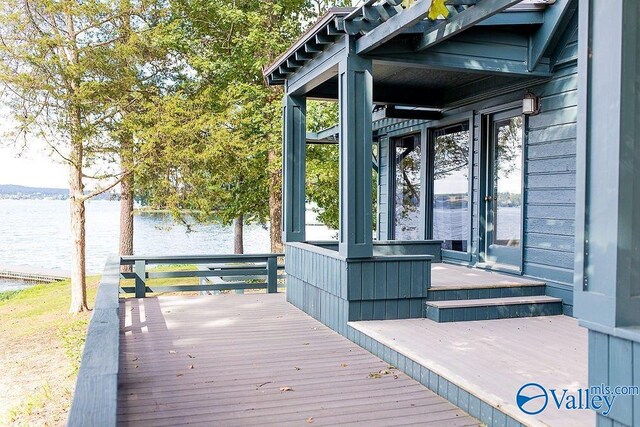 wooden deck with a water view