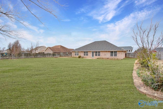 view of yard with a fenced backyard