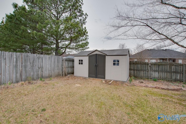 view of shed featuring a fenced backyard