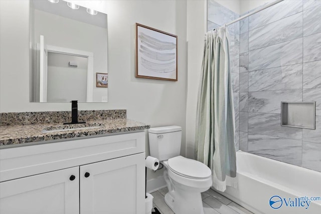 full bathroom featuring toilet, shower / bath combo with shower curtain, and vanity