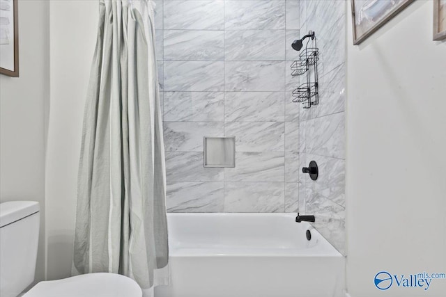 full bathroom featuring toilet and shower / bathtub combination with curtain