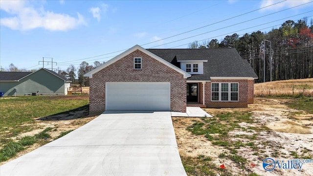 view of front of home featuring brick siding, concrete driveway, and a garage