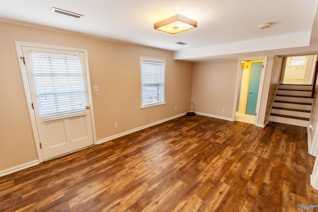 empty room with dark wood-type flooring