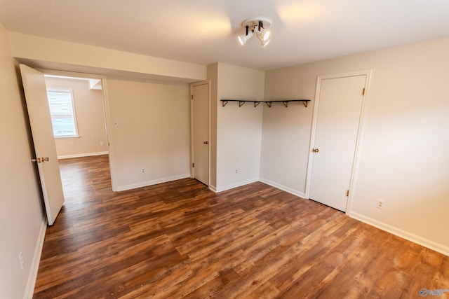 empty room featuring dark hardwood / wood-style floors