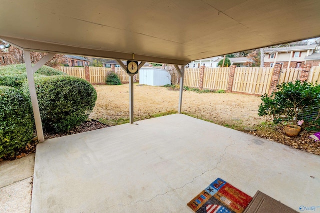 view of patio with a storage shed