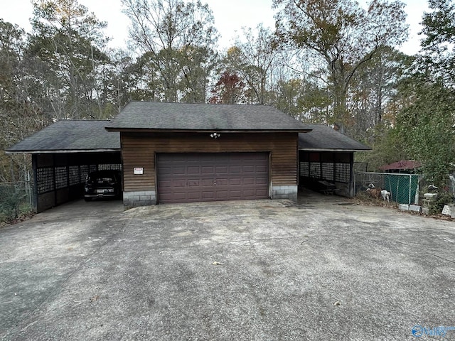 garage featuring a carport