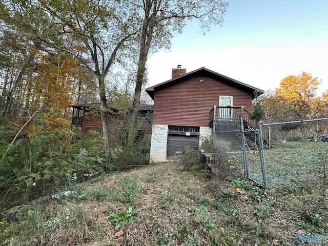 view of side of home with a garage