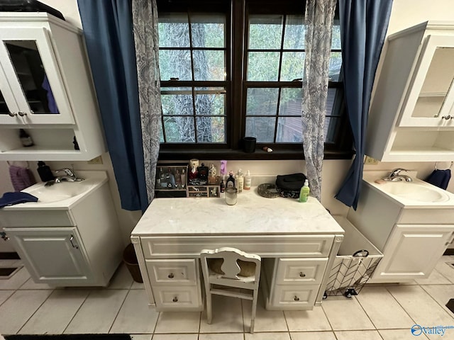 bathroom featuring tile patterned flooring and vanity