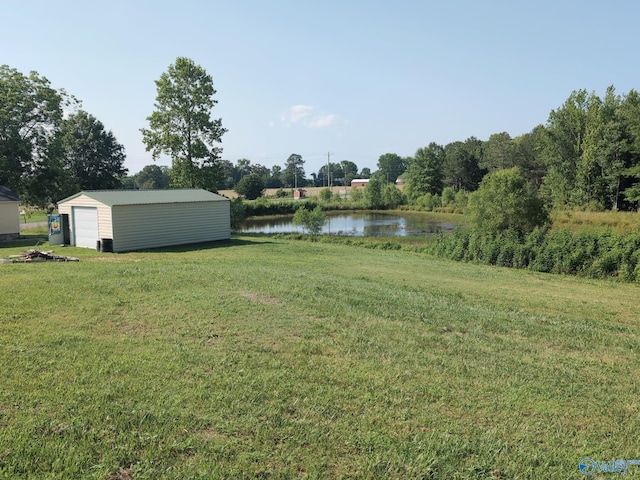 6321 Willow Rd, Ider, AL 35981 - view of green lawn with a water view, an outbuilding, and a detached garage