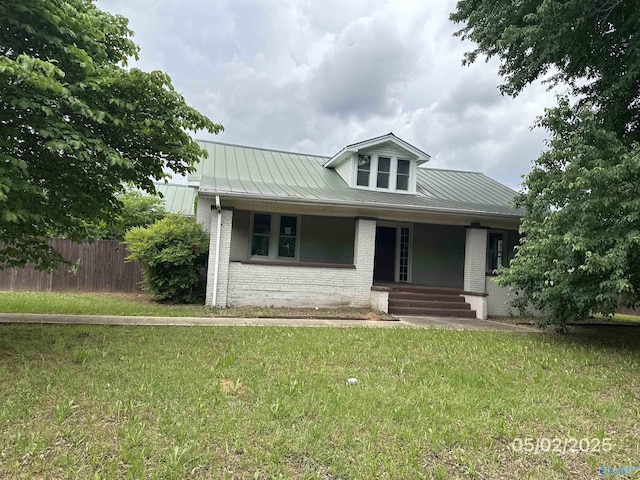 2494 Hines St S, Athens, AL 35611 - bungalow featuring brick siding, a porch, metal roof, and a standing seam roof