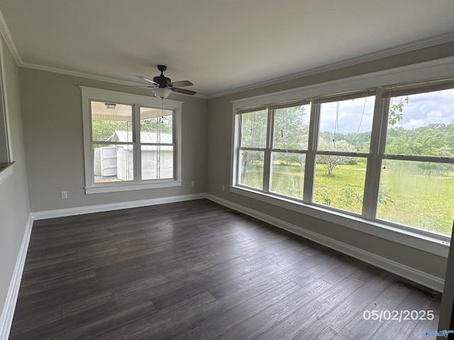 2494 Hines St S, Athens, AL 35611 - spare room featuring ceiling fan, baseboards, crown molding, and dark wood-type flooring