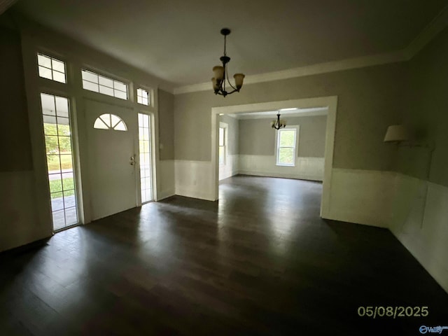 2494 Hines St S, Athens, AL 35611 - entryway featuring a chandelier, a wainscoted wall, dark wood-style floors, and ornamental molding