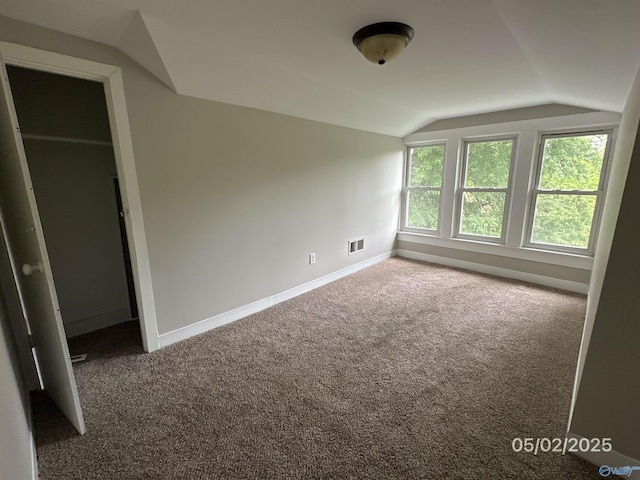 2494 Hines St S, Athens, AL 35611 - unfurnished bedroom featuring lofted ceiling, carpet flooring, and baseboards