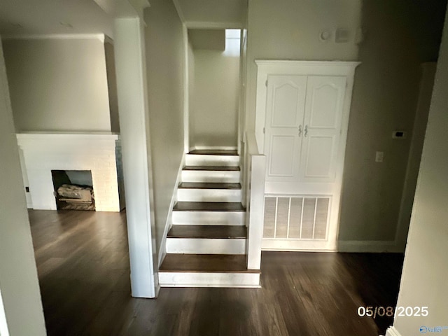 2494 Hines St S, Athens, AL 35611 - stairs featuring wood finished floors, a fireplace, and baseboards