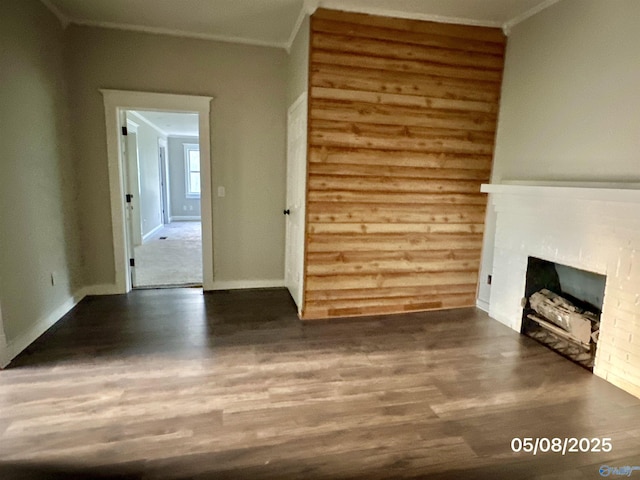 2494 Hines St S, Athens, AL 35611 - unfurnished living room featuring wood finished floors, a fireplace, crown molding, and baseboards