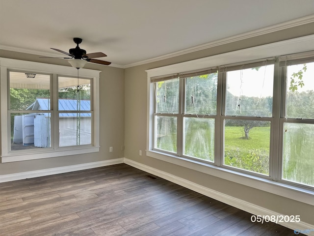 2494 Hines St S, Athens, AL 35611 - unfurnished room with baseboards, dark wood-type flooring, ceiling fan, and ornamental molding