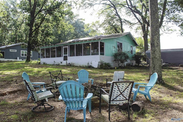 1700 County Road 102, Cedar Bluff, AL 35959 - back of house with a fire pit, a sunroom, and a yard