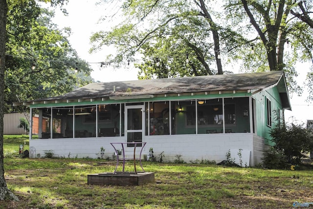 1700 County Road 102, Cedar Bluff, AL 35959 - back of property with a sunroom, roof with shingles, and a yard