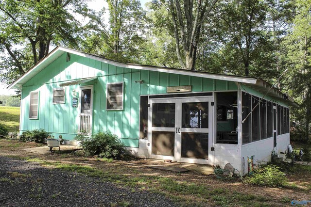 1700 County Road 102, Cedar Bluff, AL 35959 - view of side of home featuring a sunroom