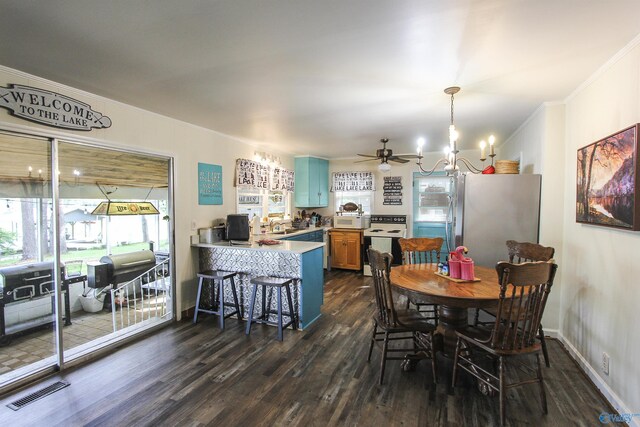 1700 County Road 102, Cedar Bluff, AL 35959 - dining area with dark wood finished floors, a chandelier, crown molding, and ceiling fan