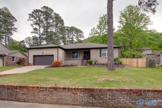 15011 Glory Dr SE, Huntsville, AL 35803 - ranch-style home featuring a garage, concrete driveway, fence, a front yard, and brick siding