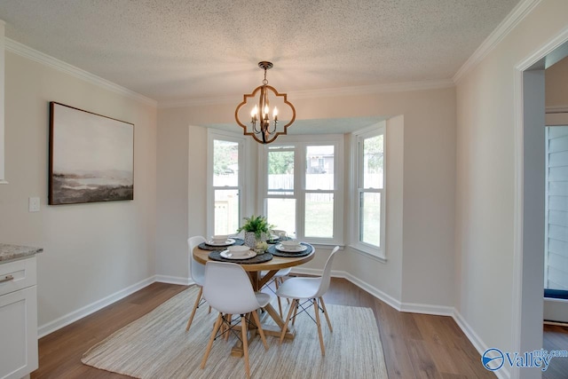 15011 Glory Dr SE, Huntsville, AL 35803 - dining space with an inviting chandelier, wood finished floors, a textured ceiling, and baseboards