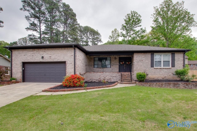 15011 Glory Dr SE, Huntsville, AL 35803 - single story home with a front lawn, concrete driveway, covered porch, brick siding, and a garage