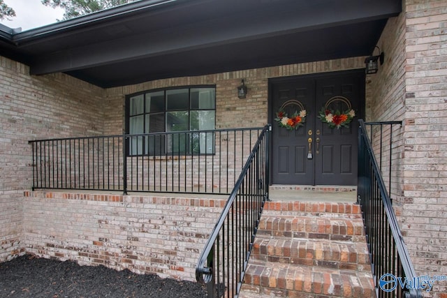 15011 Glory Dr SE, Huntsville, AL 35803 - view of exterior entry with covered porch and brick siding