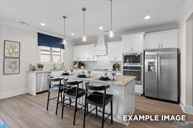 120 Burdine St, New Market, AL 35761 - kitchen featuring appliances with stainless steel finishes, custom exhaust hood, ornamental molding, and a sink
