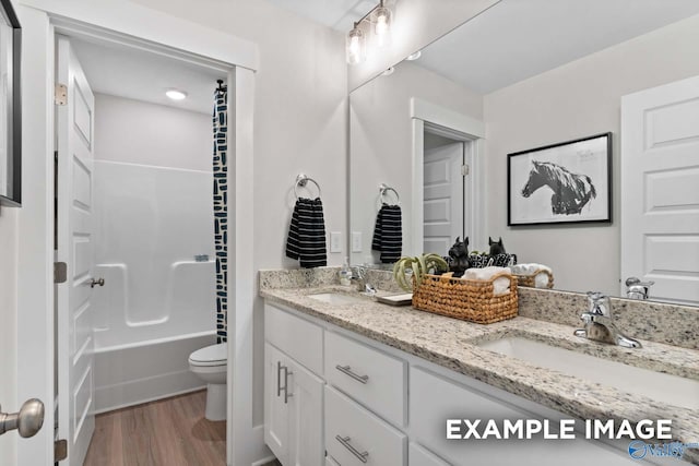 120 Burdine St, New Market, AL 35761 - full bathroom featuring wood finished floors, toilet, double vanity, and a sink