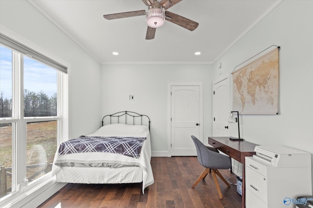 bedroom with ceiling fan, crown molding, and dark hardwood / wood-style floors