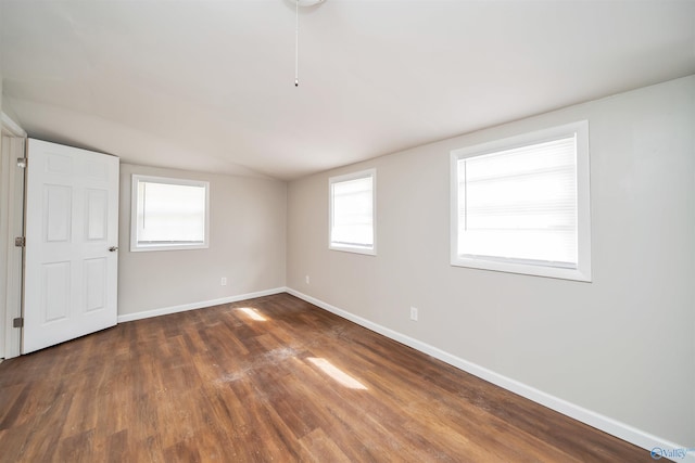 empty room with wood finished floors and baseboards
