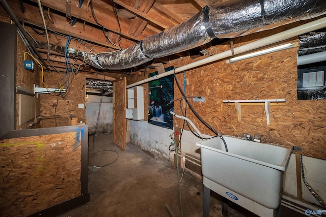 unfinished below grade area with a sink