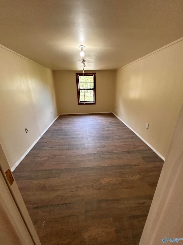 spare room featuring dark hardwood / wood-style floors