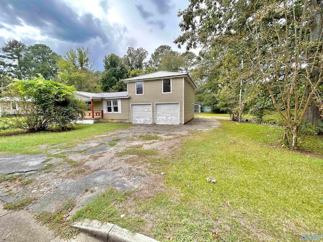 view of front of home featuring a front lawn and a garage