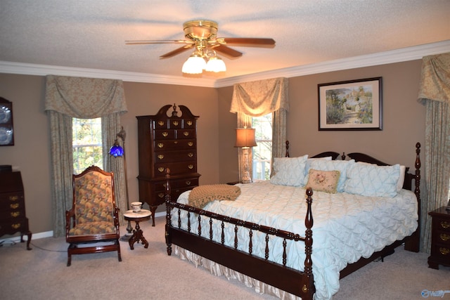 bedroom featuring ornamental molding, carpet, and ceiling fan